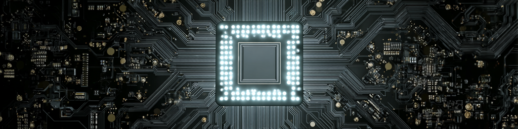 Glowing central CPU chip on intricate black circuit board for high-tech electronics