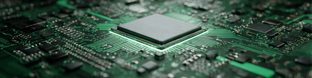 Silver chip on green circuit board, glowing green edge, surrounding electronic components, semiconductor hardware close-up
