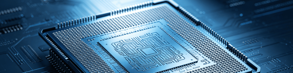 Panoramic close-up of a high-performance BGA CPU with exposed silicon die on a circuit board, representing advanced semiconductor and computing hardware technology.