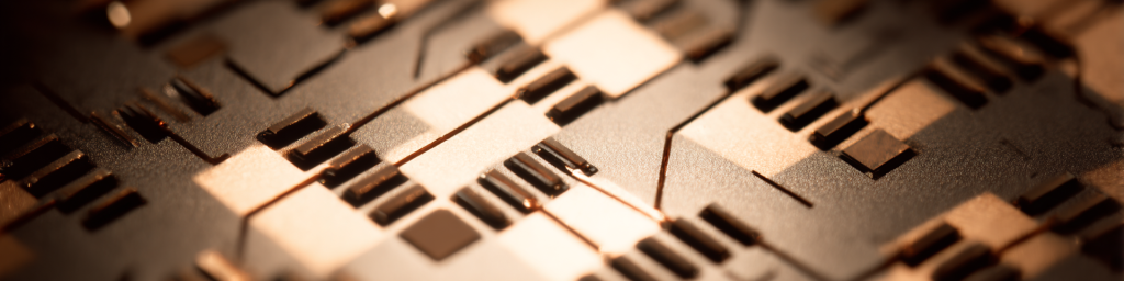 Panoramic macro shot of a PCB with copper traces, bond wires, and golden illumination, representing semiconductor manufacturing and electronic hardware technology.