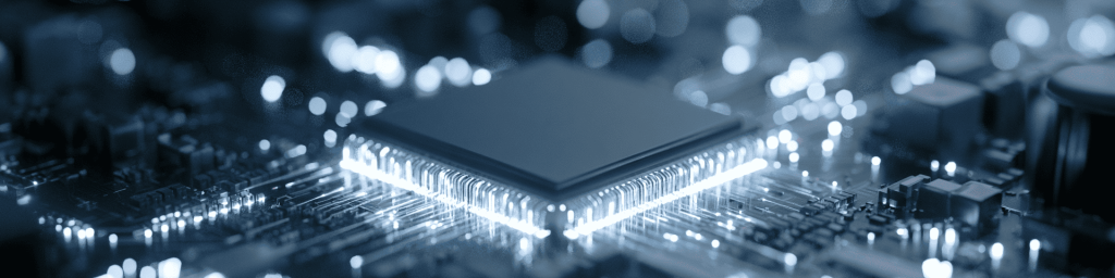 Panoramic macro view of a glowing microprocessor with bright light trails and bokeh on a circuit board, representing advanced computing power and semiconductor innovation.