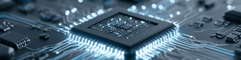 Close-up panoramic view of a glowing microprocessor on a circuit board, showing intricate connections and blue light trails, representing advanced computing and semiconductor technology.
