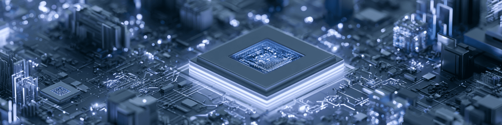 Wide blue-toned tech banner featuring a large layered central CPU chip set amid intricate glowing circuit pathways and miniature digital tech architecture.