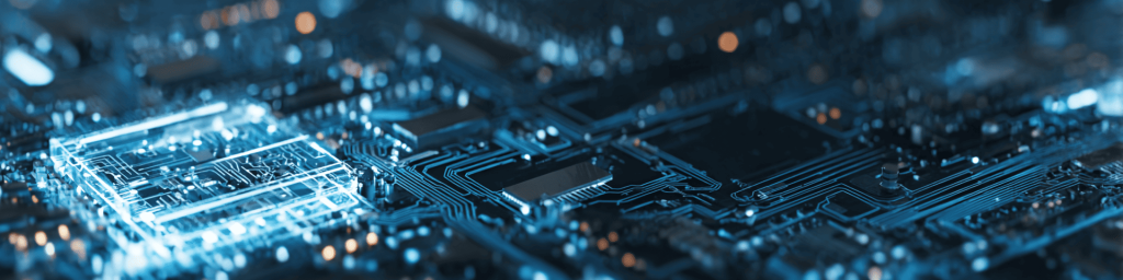 Panoramic shallow-depth close-up of luminous translucent blue CPU chip mounted on intricate circuit board, dotted with warm bokeh lights, representing advanced semiconductor and digital electronics.