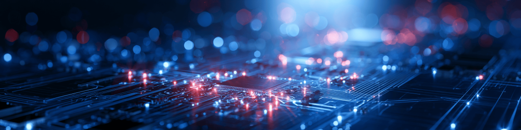 Wide banner: glowing motherboard chip with red/blue lights on a dark bokeh background.