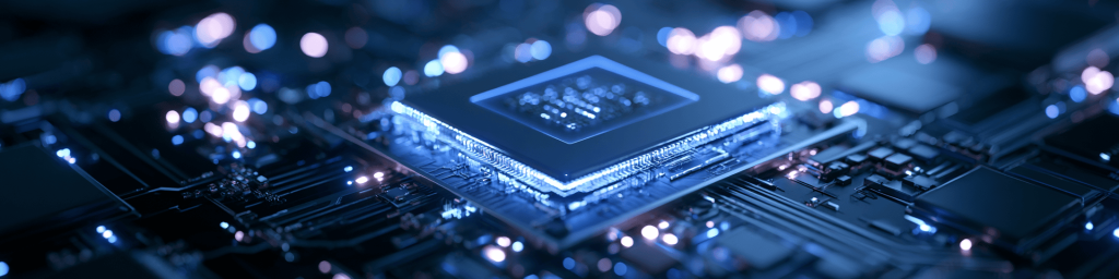 Wide banner shot of glowing high‑performance processor chip on circuit board with soft bokeh lights